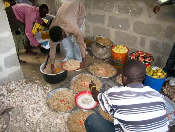 Haji preparing the mountains of food for the party