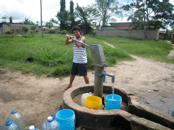 Glen collecting some water - the locals would always laugh at us :)