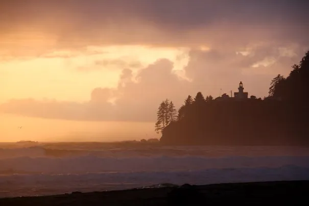 The sun setting on our third day with the lighthouse in the distance.
