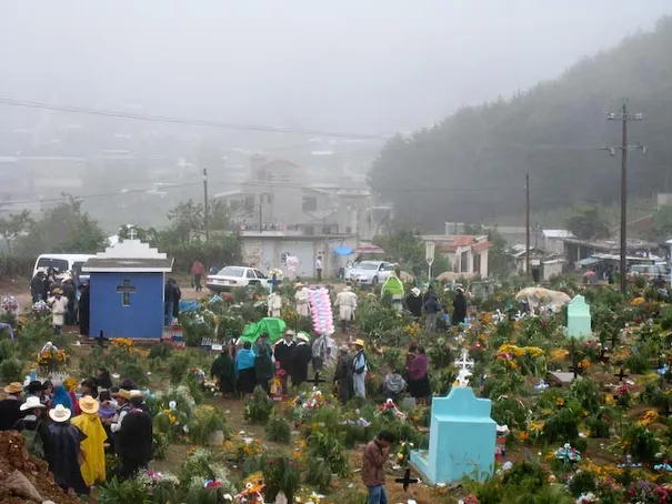 Day of the Dead. People visiting their late loved ones with offerings of beer and Coca Cola, San Cristobal, Mexico