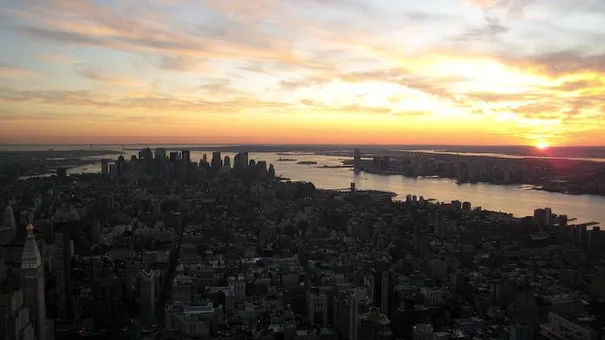 The sun setting from the top of the Empire State