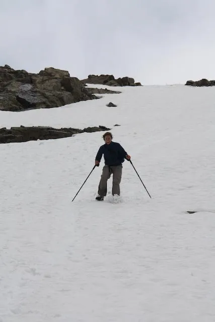 Robyn glissading down the snow