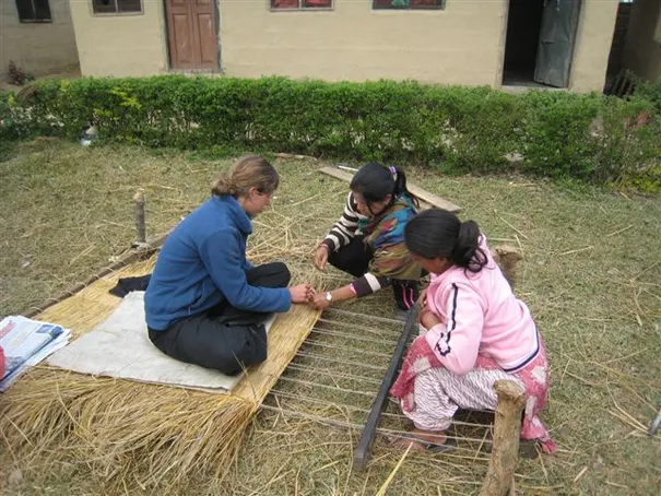 Robyn learning how to make a straw mat, Chitwan