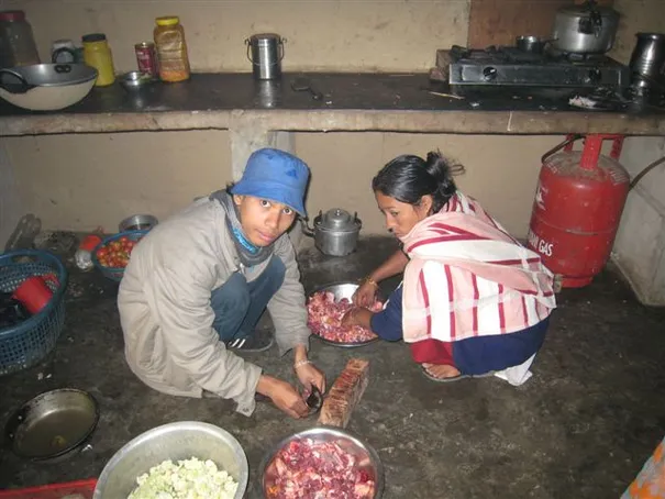 Suraz and Didi preparing the goat meat