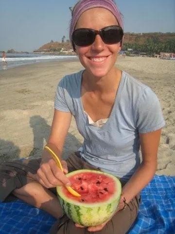 Robyn’;s breakfast of half a watermelon on Arambol Beach, Goa India.