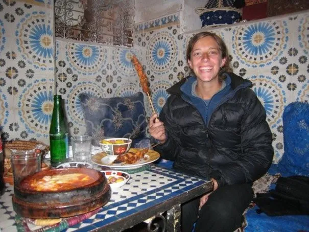 Robyn eating her Brochettes (Sheesh Kebab) at a great little restaurant in an old home in Meknes.