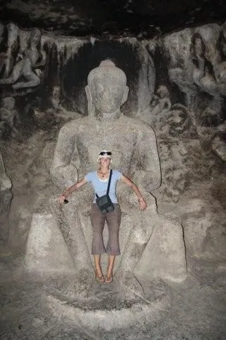 Robyn relaxing in Budha’s lap, Ellora Caves, India.